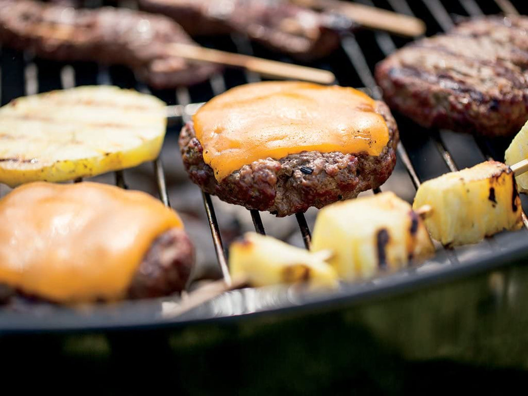Family cookout around the Weber Original Kettle charcoal grill — gift for dad from the whole family