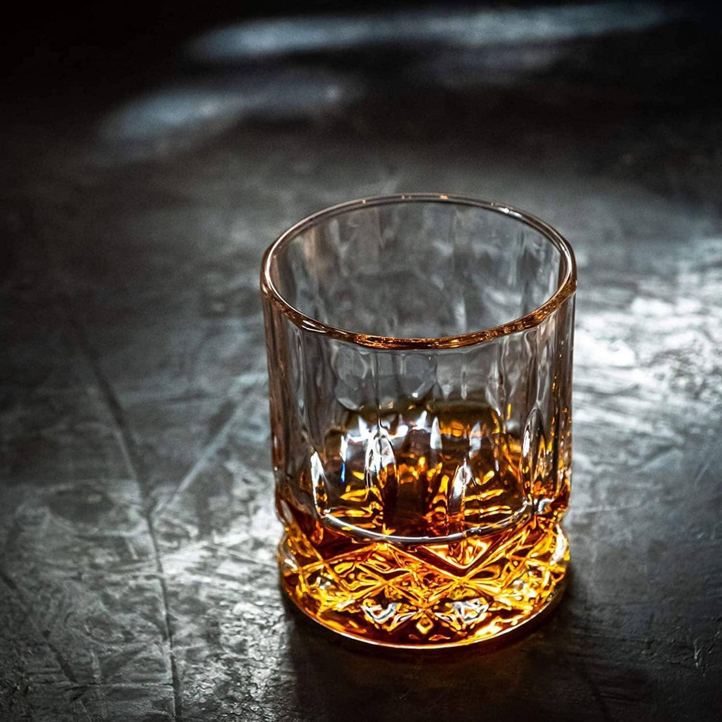 Whiskey connoisseur glass gift set signature edition — premium Father's Day gift for dad Glass of whiskey on a dark textured surface