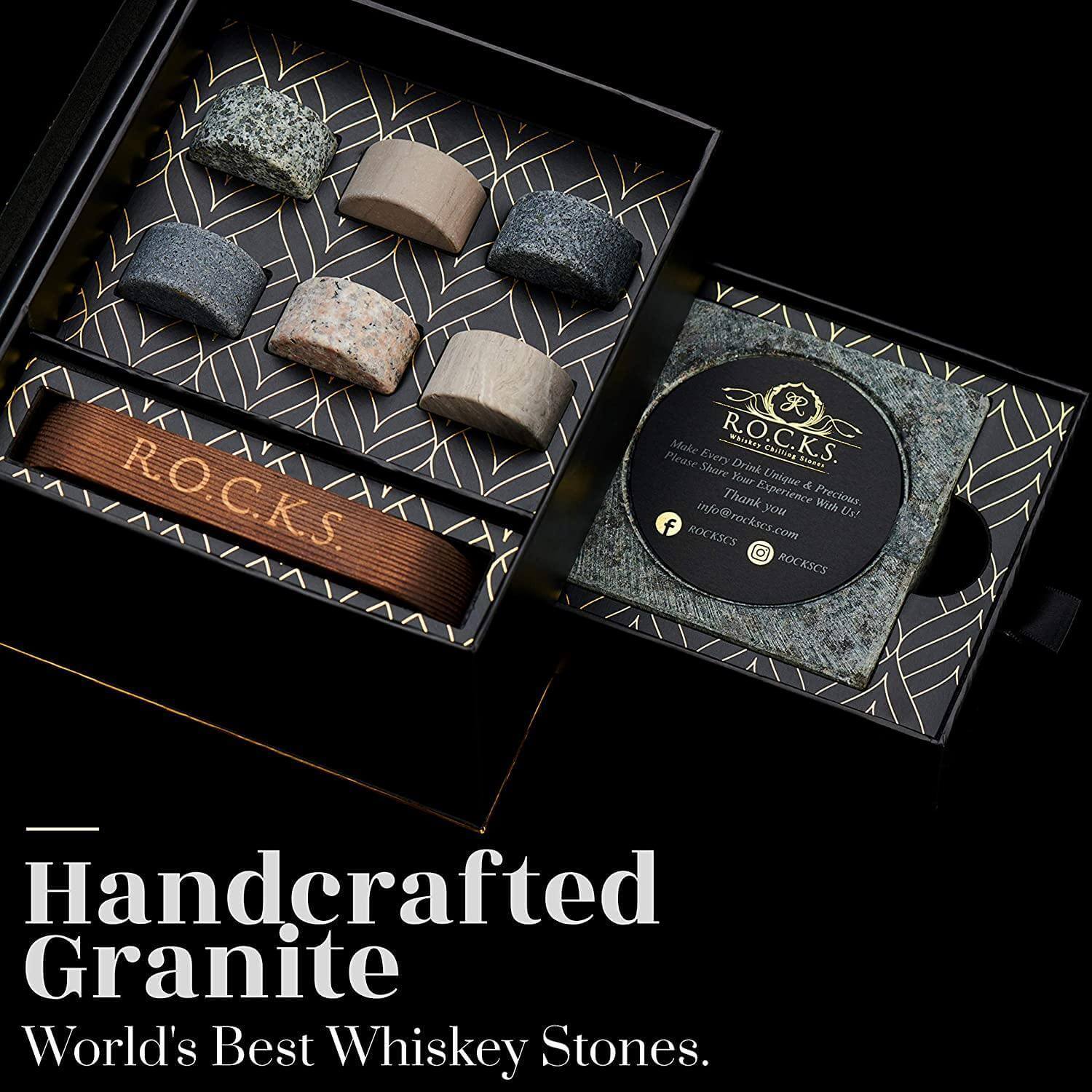 Handcrafted granite whiskey stones in a branded box on a black background luxury cigar and whiskey gift for dad