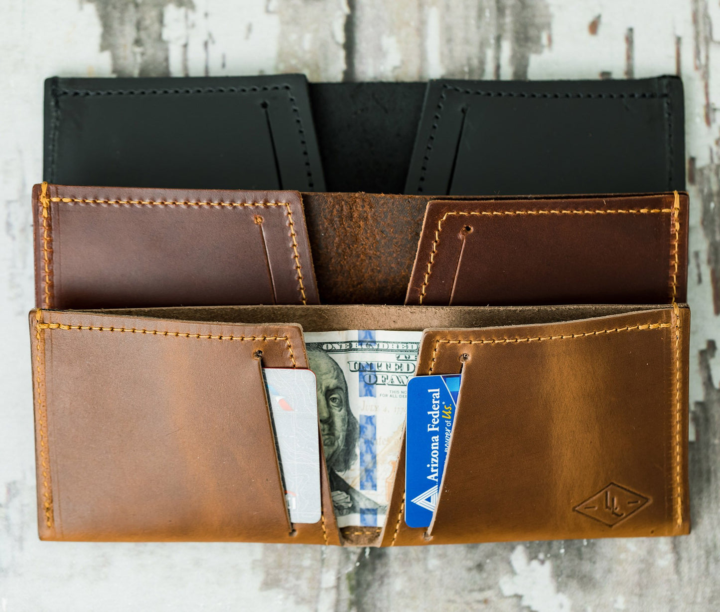 Brown leather wallet with money and cards on a wooden surface personalized gift for dad