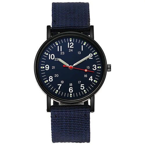Military field watch in blue with navy canvas strap, product shot on white background