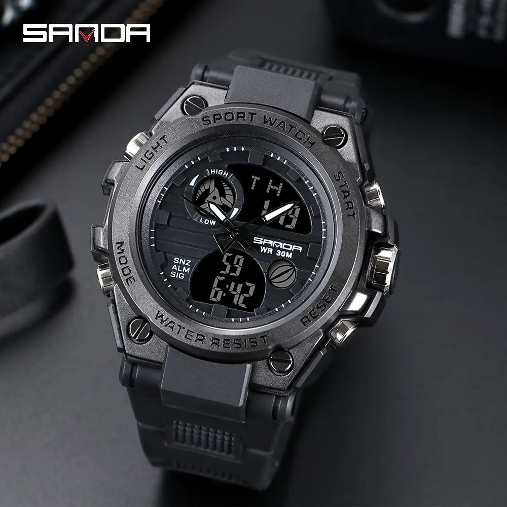 Military sport watch in all black, close-up of the analog-digital dial and sub-dials