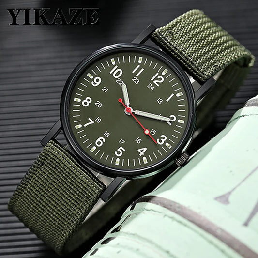Military field watch with olive canvas strap, close-up dial view showing YIKAZE branding