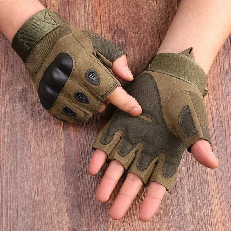 Tactical half-finger gloves in olive green worn on both hands on a wooden surface