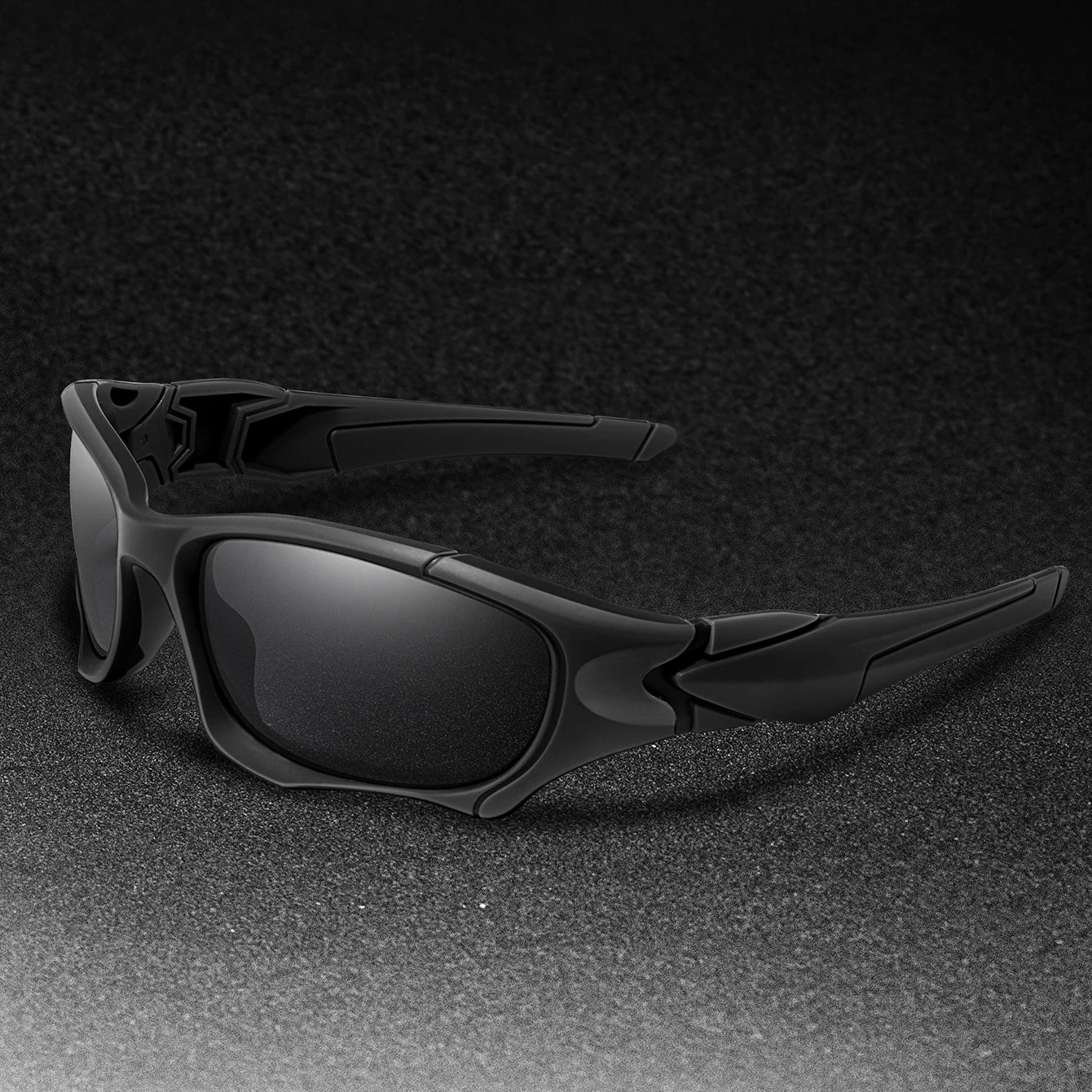 Polarized fishing sunglasses in matte black on a dark textured surface