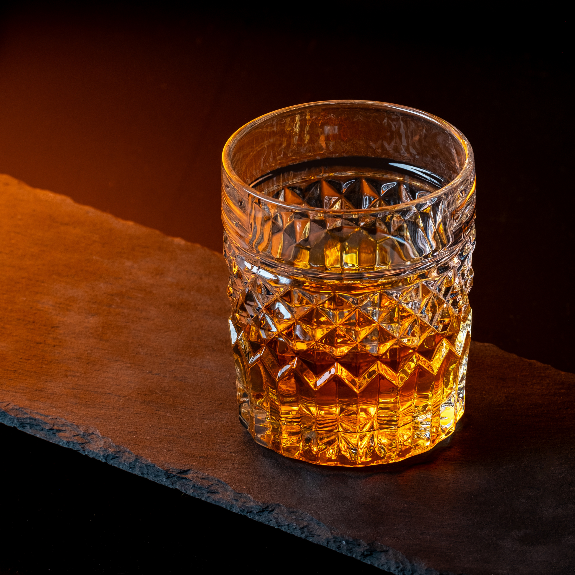 Prestige whiskey glass privilege collection — high-end gift set for dad who drinks scotch Crystal glass filled with amber liquid on a dark surface