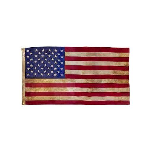 Heritage cotton American flag with tea-stained, antiqued stripes and stars, laid flat