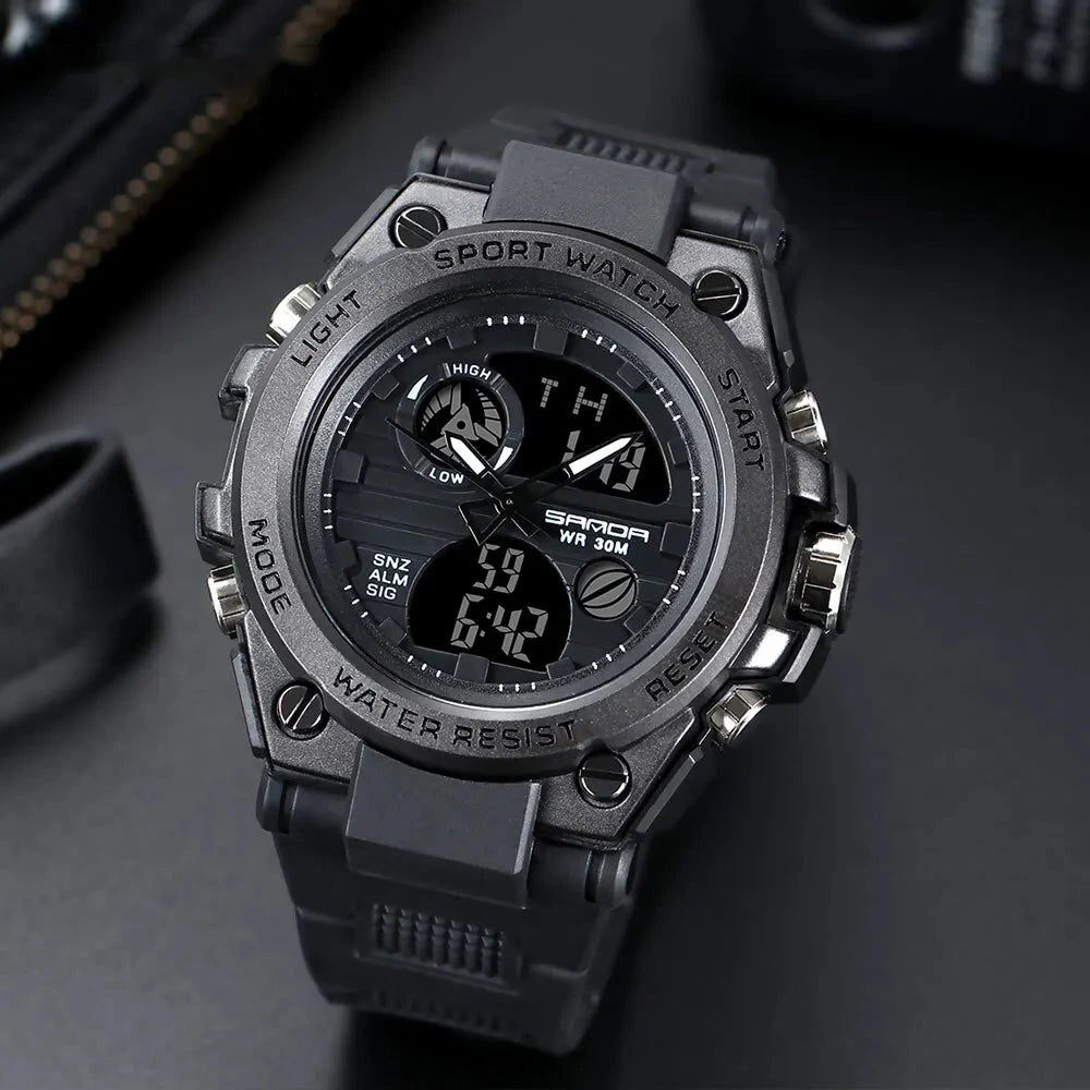 Military sport watch in all black, close-up of the analog-digital dial and sub-dials