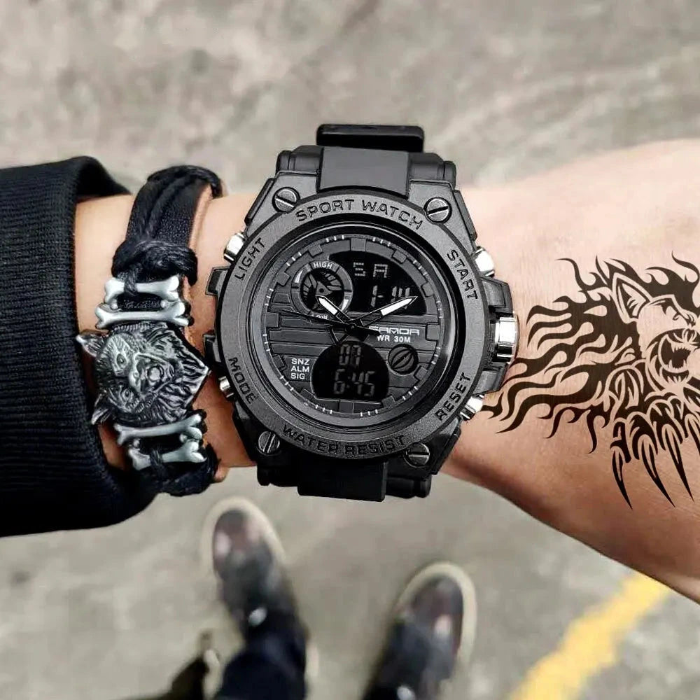 Military sport watch worn on a tattooed wrist, lifestyle shot in an urban outdoor setting