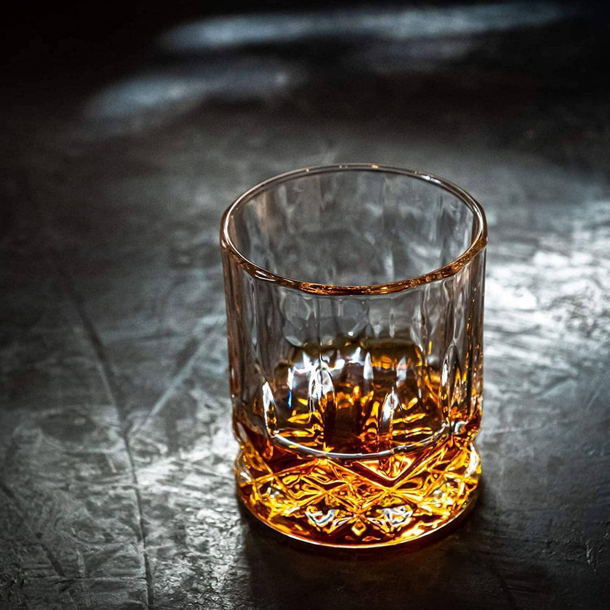 Whiskey connoisseur glass gift set signature edition — premium Father's Day gift for dad Glass of whiskey on a dark textured surface